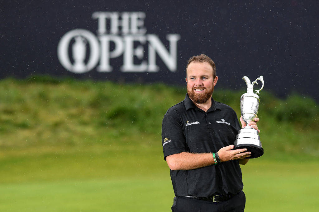 Shane Lowry poses with the Claret Jug after winning The 148th Open